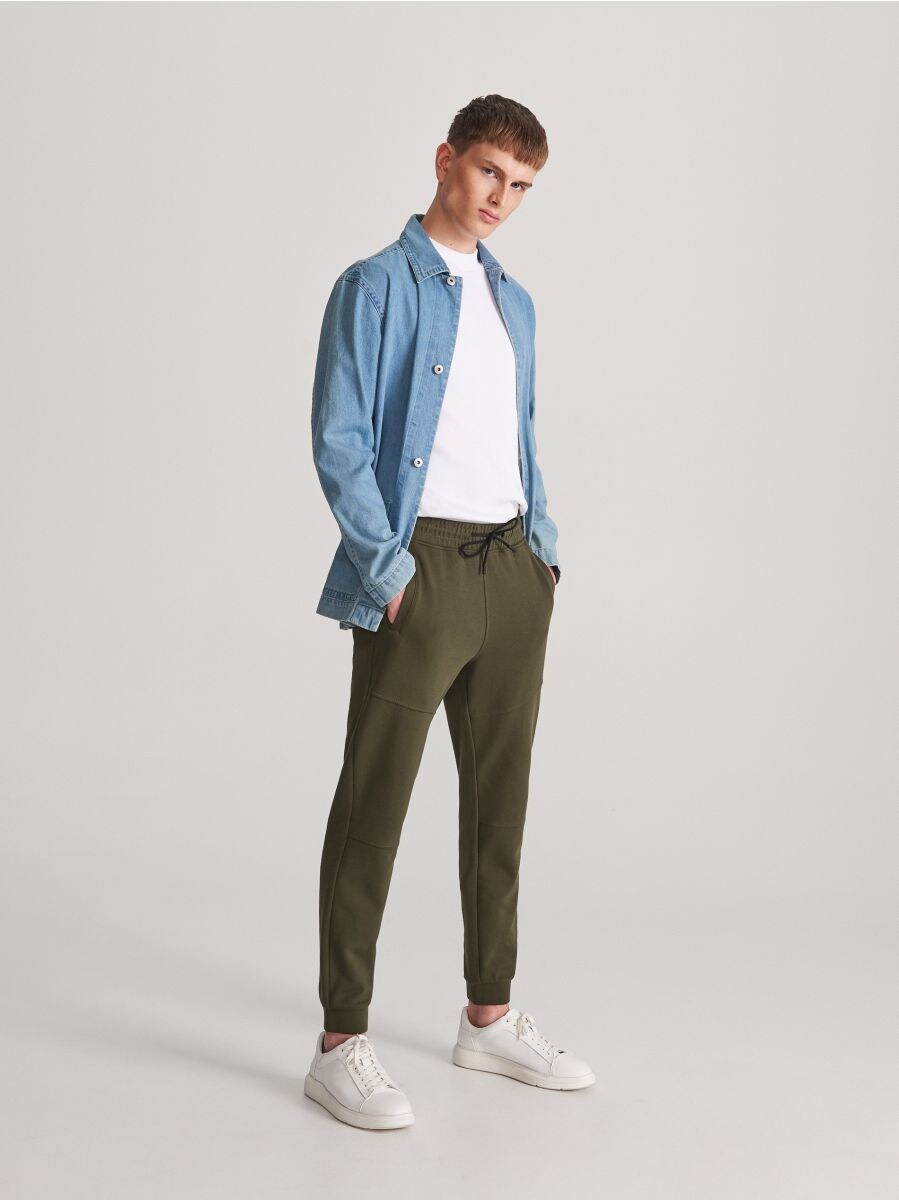 shirt and tracksuit bottoms
