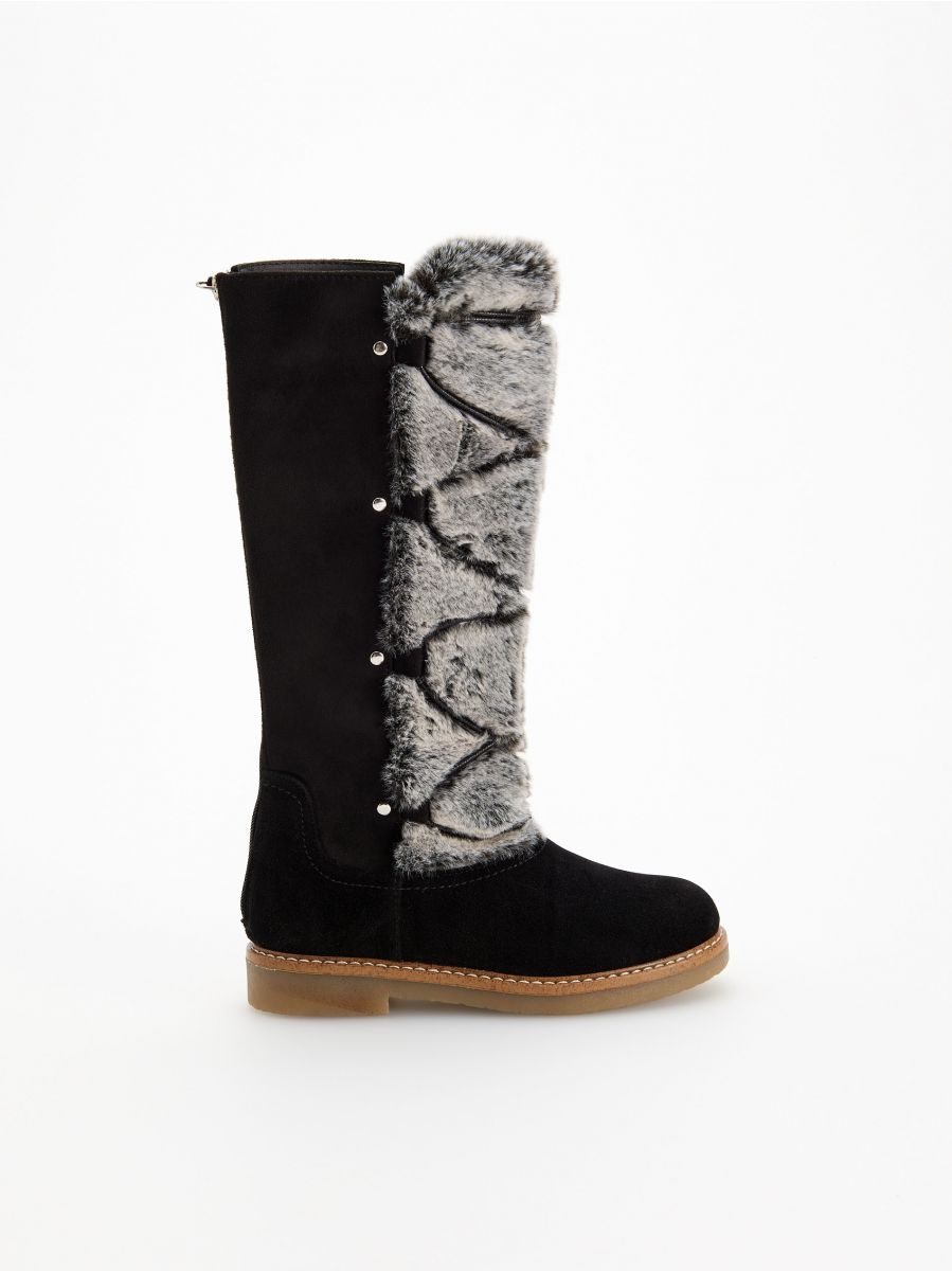 furry snow boots with pom poms